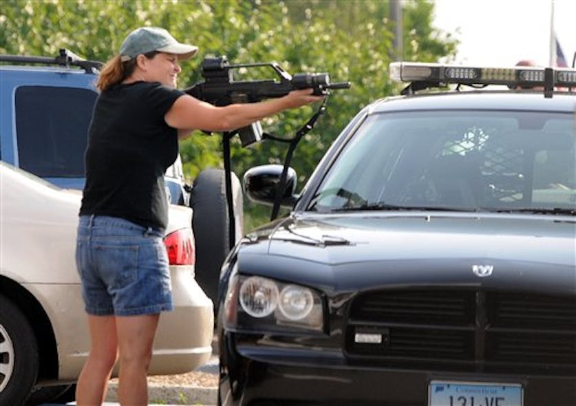 Off-duty Vernon Conn. Police Office Kate Rooney holds a weapon on a suspect of a stolen SUV.