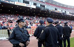 San Francisco police officers watch the crowd from the field during a preseason NFL football game. San Francisco police officers watch the crowd from the field during a preseason NFL football game.