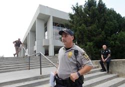 Law enforcement officers watch over Dietrick Hall after a lockdown of the campus was lifted. Law enforcement officers watch over Dietrick Hall after a lockdown of the campus was lifted.