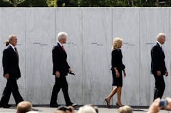 Former President George W. Bush, former President Bill Clinton, Dr. Jill Biden and Vice President Joe Biden view the Wall of Names, which displays the names of passengers and crew who died on United Flight 93 on Sept. 11, 2001, at the dedication of phase 1 of the permanent Flight 93 National Memorial near the crash site of Flight 93 in Shanksville, Pa. Saturday Sept. 10, 2011.