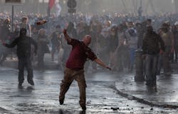 Protesters hurl objects at police in Rome, Saturday, Oct. 15, 2011.