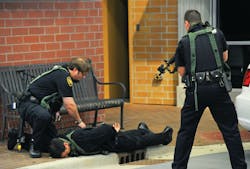 Officers participating in the reenactment were outfitted with Cubic's MILES Individual Weapons System kits, worn by trainees and laser transmitters for pistols and shotguns. Officers participating in the reenactment were outfitted with Cubic's MILES Individual Weapons System kits, worn by trainees and laser transmitters for pistols and shotguns.