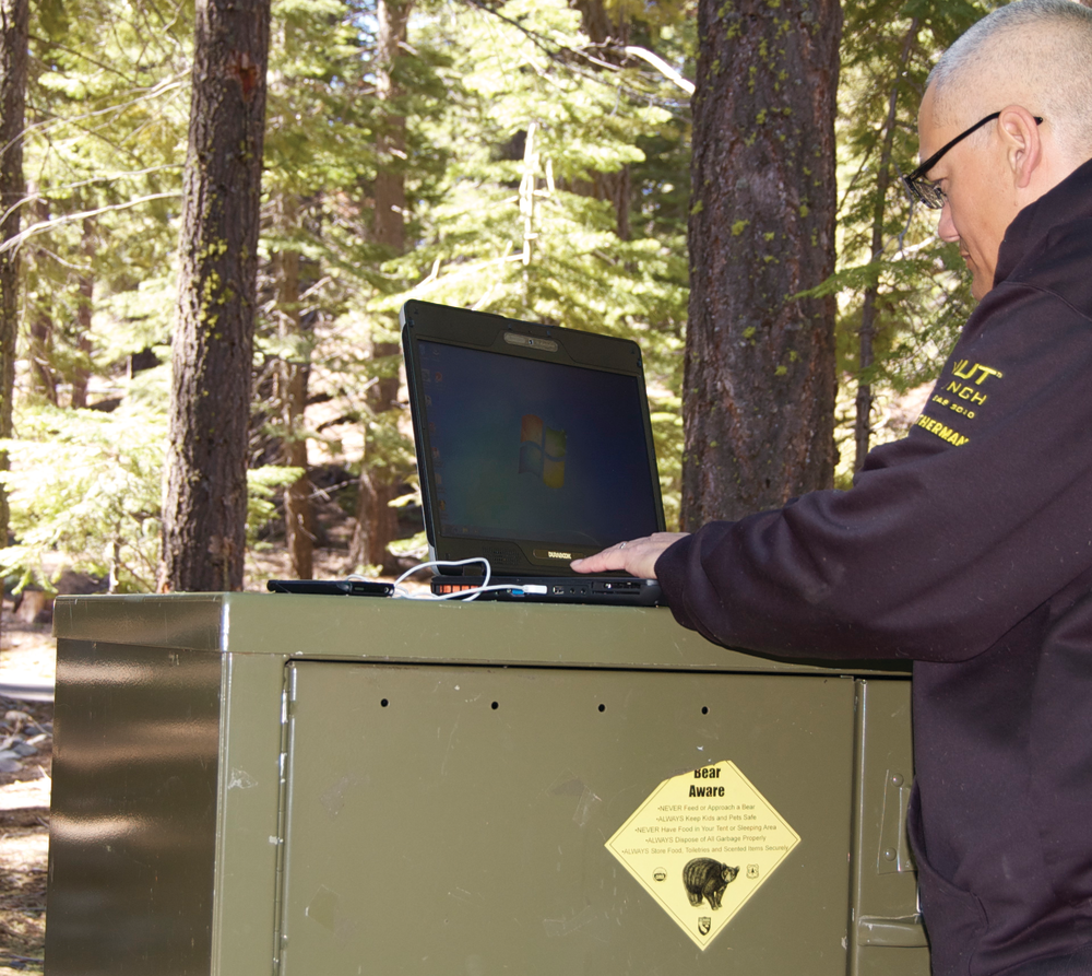 Lindsey Bertomen testing the GammaTech S15C semi-rugged notebook in the rugged woods.