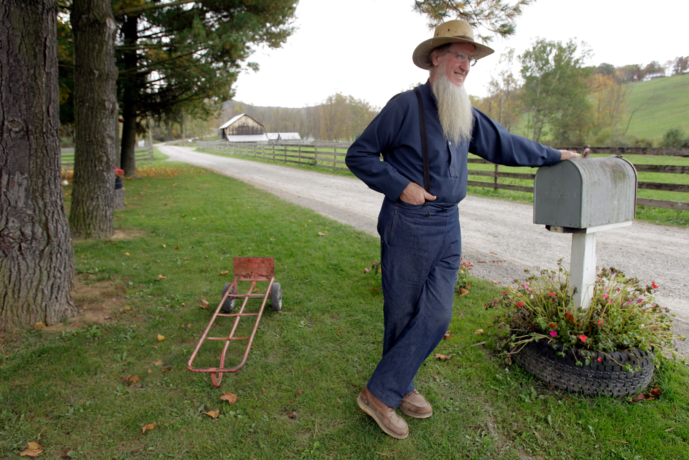 In this Oct. 10, 2011 file photo, Sam Mullet leans on the mailbox at his home in Bergholz, Ohio. Mullet is the reputed leader of the breakaway Amish sect.