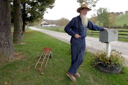 In this Oct. 10, 2011 file photo, Sam Mullet leans on the mailbox at his home in Bergholz, Ohio. Mullet is the reputed leader of the breakaway Amish sect. In this Oct. 10, 2011 file photo, Sam Mullet leans on the mailbox at his home in Bergholz, Ohio. Mullet is the reputed leader of the breakaway Amish sect.