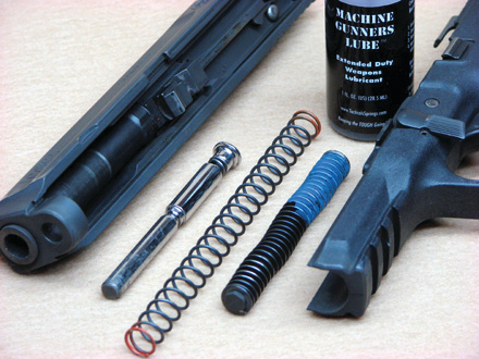Here&rsquo;s the Sprinco replacement guide rod and spring, alongside the M&P&rsquo;s standard rod and captive spring. Also pictured is the top-notch Machine Gunner&rsquo;s Lube that the company offers.