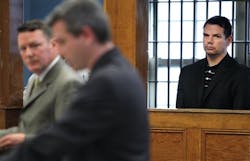 Grant D. Smith, 47, far right, a University of Utah professor, is arraigned at East Boston District Court in Boston, Monday, Nov. 28, 2011.