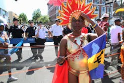 In this Sept. 26, 2010 photo, police stand along the route of the West Indian-American Day Parade as parade participants make their way along Eastern Parkway in the Brooklyn borough of New York. In this Sept. 26, 2010 photo, police stand along the route of the West Indian-American Day Parade as parade participants make their way along Eastern Parkway in the Brooklyn borough of New York.