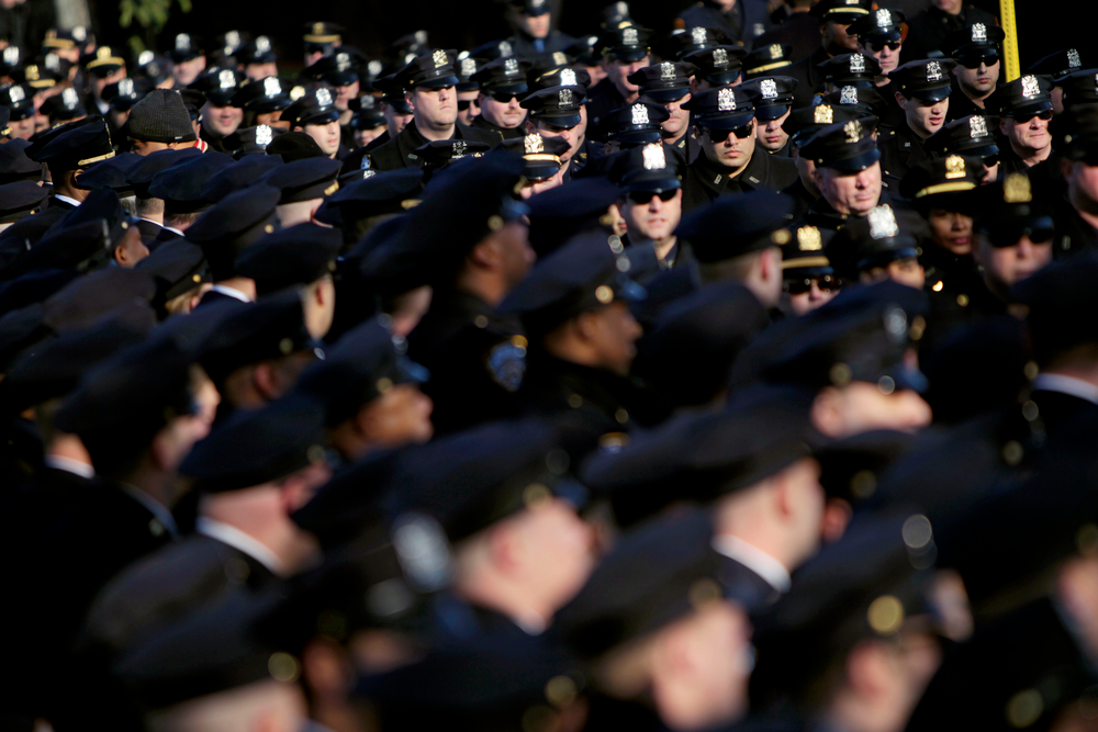 Police officers line up for Officer Peter Figoski's funeral in Babylon, N.Y.