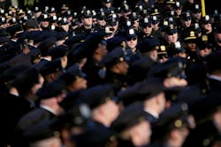Police officers line up for Officer Peter Figoski&apos;s funeral in Babylon, N.Y.