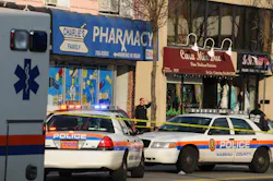A police officer stands on the sidewalk in front of Charlie’s Family Pharmacy in Seaford, N.Y., Saturday, Dec. 31, 2011. A police officer stands on the sidewalk in front of Charlie’s Family Pharmacy in Seaford, N.Y., Saturday, Dec. 31, 2011.