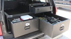 SUV outfitted with law enforcement weapons and gear in Hitec compartments
