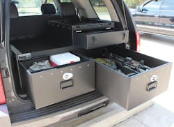 SUV outfitted with law enforcement weapons and gear in Hitec compartments