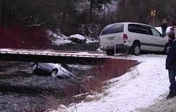 A photo provided by Chris Willden shows a car in the Logan River in Utah Saturday Dec. 31, 2011, after the car was flipped upright by rescuers who saved three children trapped in the car.