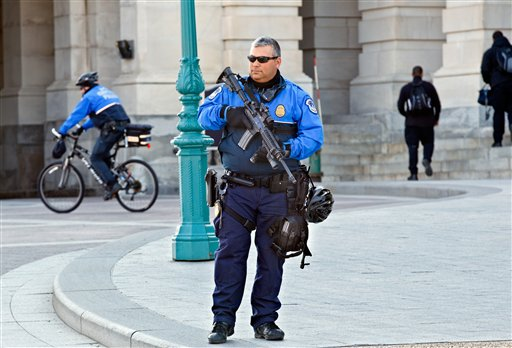 A Capitol Police officers keep watch on Capitol Hill in Washington, Friday, Feb. 17, 2012. A 29-year-old Moroccan man was arrested Friday near the U.S. Capitol as he was planning to detonate what he thought was a suicide vest, given to him by FBI undercover operatives, said police and government officials.