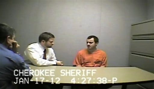 In this Jan. 17, 2012 photo made from video and provided by the Cherokee (Ga.) Sheriff Department, convicted child killer Ryan Brunn is interviewed by authorities after his arrest near Kennesaw, Ga.