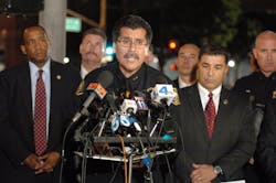 Deputy Chief Robert Luna surrounded by various branches of law enforcement speaks at a news conference to confirm the events of Thursday evening Feb. 16 which resulted in the death of an ICE agent at the Glenn M. Anderson Federal Building in Long Beach.