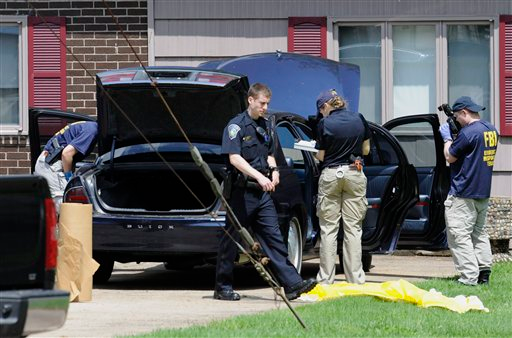 Law enforcement agents search a car at the home of reputed Connecticut mobster Robert Gentile in Manchester, Conn., looking for paintings stolen from Boston's Isabella Stewart Gardener Museum in 1990, worth half a billion dollars.
