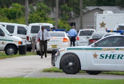 Emergency personnel surround the scene of a multiple shooting in Port St. John, Brevard County, Fla., Tuesday, May 15, 2012. Sheriff&apos;s deputies in Brevard County said 33-year-old Tanya Thomas on Tuesday shot her four children, who ranged in age from 12 to 17, before shooting herself.