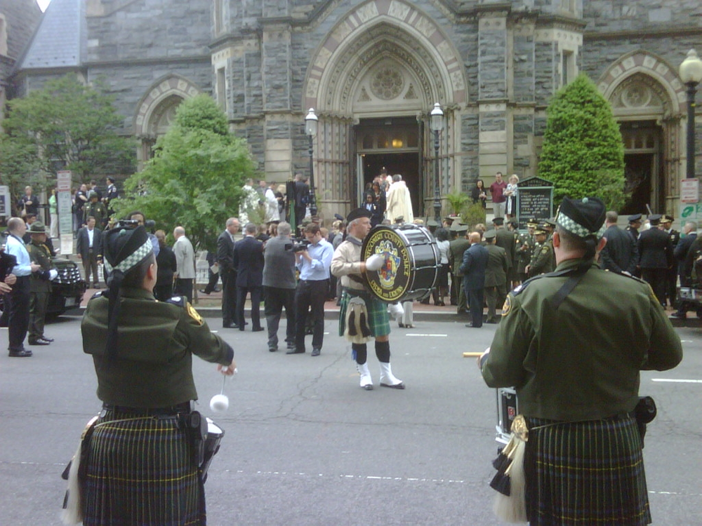 Pipers play in front of St. Patrick's Catholic Church where the annual Blue Mass was held Tuesday.