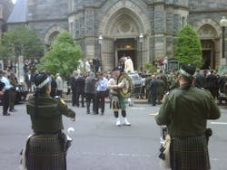 Pipers play in front of St. Patrick's Catholic Church where the annual Blue Mass was held Tuesday. Pipers play in front of St. Patrick's Catholic Church where the annual Blue Mass was held Tuesday.