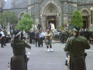 Pipers play in front of St. Patrick&apos;s Catholic Church where the annual Blue Mass was held Tuesday.