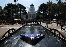 A folded American flag is left on a wagon at the Peace Officers Memorial during ceremonies in Sacramento, Calif., Monday, May 7, 2012. Gov. Jerry Brown joined state officials and hundreds of law enforcement officers in paying tribute to eight officers who died in the line of duty last year and 10 past fallen officers. A folded American flag is left on a wagon at the Peace Officers Memorial during ceremonies in Sacramento, Calif., Monday, May 7, 2012. Gov. Jerry Brown joined state officials and hundreds of law enforcement officers in paying tribute to eight officers who died in the line of duty last year and 10 past fallen officers.