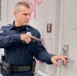 Lshspolicegunpointedatdoor 10727770 Lshspolicegunpointedatdoor 10727770