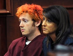 In this Monday, July 23, 2012 file photo, James Holmes, accused of killing 12 people in Friday&apos;s shooting rampage in an Aurora, Colo., movie theater, appears in Arapahoe County District Court with defense attorney Tamara Brady in Centennial, Colo. With their anger and tears stirred by the sight of Holmes in a courtroom with red hair and glassy eyes, the families of those killed in the Colorado theater massacre now must go home to plan their final goodbyes.