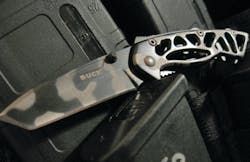 Buck Knives Small Bones Knife on vest Buck Knives Small Bones Knife on vest