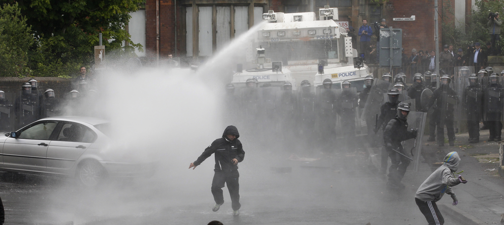 Nationalist rioters clash with Police Service of Ireland in the Ardoyne area of North Belfast, Northern Ireland, Thursday, July 12, 2012. Trouble broke out after an Orange Order march passed the area. The Twelfth of July is the busiest day of the marching season in Northern Ireland with thousands of Orangemen and women, accompanied by marching bands, taking part in hundreds of parades. The Orange Order holds its main Belfast event, which commemorates King William III's 1690 Battle of the Boyne victory over Catholic King James II.