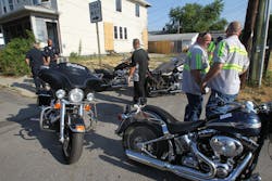 Motorcycles are removed from the clubhouse area of the Outlaws Motorcycle Gang in Indianapolis Wednesday July 11, 2012, after federal and local law enforcement officers raided Indianapolis and Fort Wayne sites Wednesday that are tied to the Outlaws motorcycle gang and rounded up members to face charges that remained sealed.