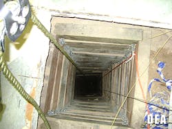 In this undated photo provided by the United States Drug Enforcement Administration, shows the tunnel shaft entrance on the U.S. side of a 240-yard, complete and fully operational drug smuggling tunnel that ran from a small business in Arizona to an ice plant on the Mexico side of the border, Thursday, July 12, 2012, in San Luis, Ariz.