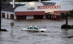 A sheriff's vehicle sits in flood waters caused by Isaac, Thursday, Aug. 30, 2012, north of LaPlace, La, off Lake Pontchartrain. Isaac's maximum sustained winds had decreased to 45 mph and the National Hurricane Center said it was expected to become a tropical depression by Thursday night. The storm's center was on track to cross Arkansas on Friday and southern Missouri on Friday night, spreading rain as it goes. A sheriff's vehicle sits in flood waters caused by Isaac, Thursday, Aug. 30, 2012, north of LaPlace, La, off Lake Pontchartrain. Isaac's maximum sustained winds had decreased to 45 mph and the National Hurricane Center said it was expected to become a tropical depression by Thursday night. The storm's center was on track to cross Arkansas on Friday and southern Missouri on Friday night, spreading rain as it goes.