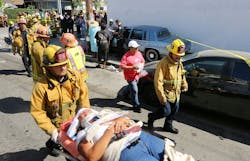 A Los Angeles City firefighter assists one of eight people injured when a car sped onto a sidewalk and plowed into a group of parents and children outside Main Street Elementary school, Wednesday Aug. 29, 2012 in Los Angeles. The crash occurred at 2:50 p.m., shortly after school had let out for the day, according to a statement from the Los Angeles Unified School District. Some of the people injured were children. A Los Angeles City firefighter assists one of eight people injured when a car sped onto a sidewalk and plowed into a group of parents and children outside Main Street Elementary school, Wednesday Aug. 29, 2012 in Los Angeles. The crash occurred at 2:50 p.m., shortly after school had let out for the day, according to a statement from the Los Angeles Unified School District. Some of the people injured were children.