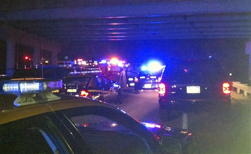 Emergency vehicles line the road near the scene of a fatal shooting Tuesday in Wallback in Clay County, W. Va., Tuesday Aug. 28, 2012. Officials say a West Virginia State Trooper and the suspect were killed during a traffic stop Tuesday night.
