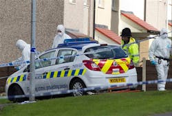 Police forensics staff work near the scene in Greater Manchester where two unarmed female police officers were killed in a gun and grenade attack, which led to the arrest of a wanted man. PC Nicola Hughes, 23, and PC Fiona Bone, 32, were killed to Abbey Gardens in Mottram near Manchester whilst investigating what turned out to be a false report of a burglary, in Manchester, England, Wednesday, Sept. 19, 2012. Police forensics staff work near the scene in Greater Manchester where two unarmed female police officers were killed in a gun and grenade attack, which led to the arrest of a wanted man. PC Nicola Hughes, 23, and PC Fiona Bone, 32, were killed to Abbey Gardens in Mottram near Manchester whilst investigating what turned out to be a false report of a burglary, in Manchester, England, Wednesday, Sept. 19, 2012.