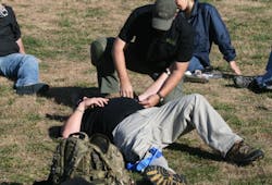 Beyond the Band-Aid course requires participants to learn how to save a life as well as take one. Beyond the Band-Aid course requires participants to learn how to save a life as well as take one.