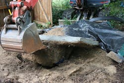 In this Monday, Oct. 8, 2012 photo provided by the Winder Police Department, crews excavate a body that was entombed in concrete, stuffed inside a plastic storage container, and buried in the back yard of a home in Winder, Ga. Police believe the remains could be those of a missing Florida man. 31-year-old twins Christopher and William Cormier were arrested Tuesday, charged with concealing a death. In this Monday, Oct. 8, 2012 photo provided by the Winder Police Department, crews excavate a body that was entombed in concrete, stuffed inside a plastic storage container, and buried in the back yard of a home in Winder, Ga. Police believe the remains could be those of a missing Florida man. 31-year-old twins Christopher and William Cormier were arrested Tuesday, charged with concealing a death.