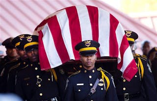 An honor guard carries the casket containing to remains of Atlanta Police Helicopter Pilot Richard J. Halford during a memorial service on Nov. 9.
