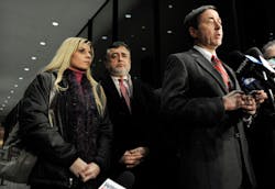Bartender Karolina Obrycka, left, listens while her attorney Terry Ekl, right, speaks during a news conference in Chicago on Nov. 13. Bartender Karolina Obrycka, left, listens while her attorney Terry Ekl, right, speaks during a news conference in Chicago on Nov. 13.