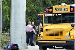 Police investigate the scene of a shooting on a school bus in Homestead, Fla., near Miami, Tuesday, Nov. 20, 2012.