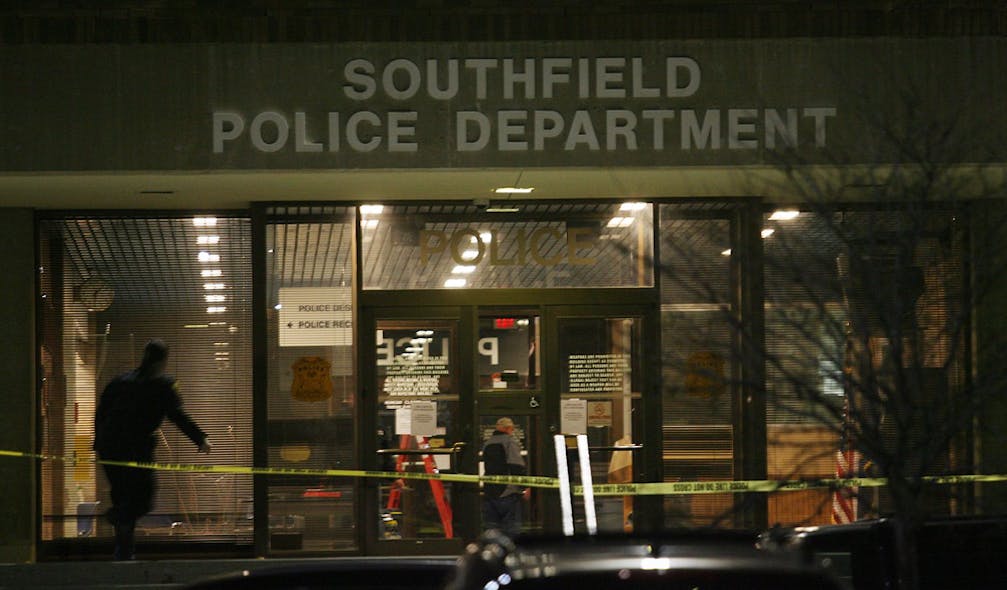Caution tape blocks the entrance of the Southfield Police Department, Sunday, Nov. 11, 2012 in Southfield, Mich.