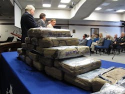 More than 50 pounds of cocaine seized from suspected drug dealers is displayed by authorities during a news conference on Dec. 3 in Savannah, Ga.