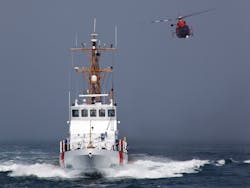 A Rescue Helicopter from Airs Station Los Angeles conducts a close fly-by of the Coast Guard Cutter Halibut. A Rescue Helicopter from Airs Station Los Angeles conducts a close fly-by of the Coast Guard Cutter Halibut.
