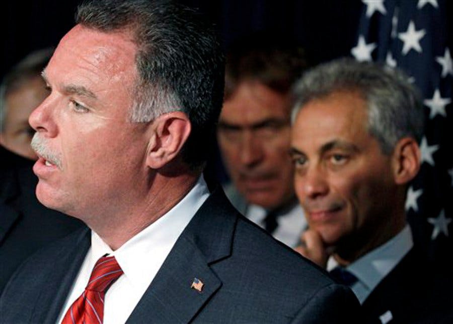 Police Superintendent Garry McCarthy, left, and Chicago Mayor Rahm Emanuel, rear, appear during a news conference in Chicago.