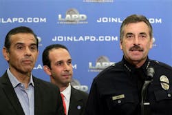 Los Angeles Mayor Antonio Villaraigosa, left, and LAPD Chief Charlie Beck, right, announce the arrest of four suspects.
