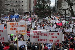Thousands of protesters outside the state Capitol in Lansing, Mich. showed up to protest the signing of the right-to-work bill by Gov. Rick Snyder on Dec. 11. Thousands of protesters outside the state Capitol in Lansing, Mich. showed up to protest the signing of the right-to-work bill by Gov. Rick Snyder on Dec. 11.