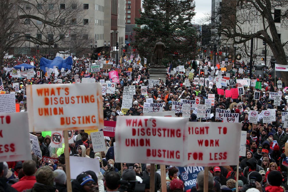 Thousands of protesters outside the state Capitol in Lansing, Mich. showed up to protest the signing of the right-to-work bill by Gov. Rick Snyder on Dec. 11.