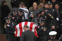 The casket of Cold Spring-Richmond Officer Thomas Decker is carried from St. John's Abbey and University Church at St. John's University in Collegeville, Minn. on Dec. 5. The casket of Cold Spring-Richmond Officer Thomas Decker is carried from St. John's Abbey and University Church at St. John's University in Collegeville, Minn. on Dec. 5.